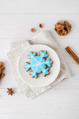 gingerbread with icing on a white wooden background