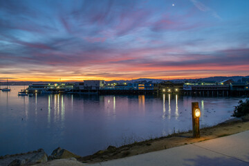 Fototapeta na wymiar Sunrise over Old Fishermans Wharf in Monterey, CA