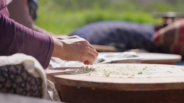 Turkish elderly woman making falafel flat bread. Traditional turkish cuisine
