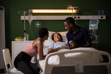 African parents com in hospital to their daughter who is in hospital.