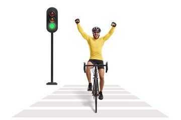 Male cyclist riding a road bicycle at a pedestrian crossing