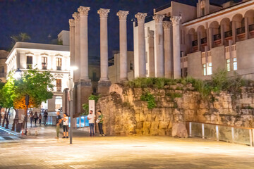 Fototapeta premium Cordoba, Spain - April 11, 2023: Tourists along the city streets at night
