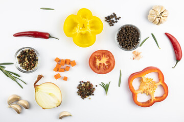 Pepper blend, spices, fresh vegetables and herbs isolated on a white background.