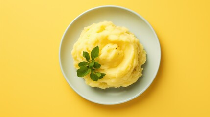 A bowl of creamy mashed potatoes topped with a sprig of fresh green herbs, presented on a white plate against a bright yellow background - Powered by Adobe