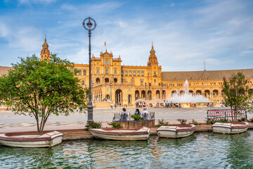 Sevilla, Spain - April 10, 2023: Tourists enjoy outdoor time in Plaza de Espana at sunset