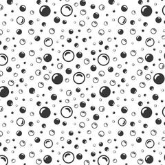 black soap bubbles on a white background