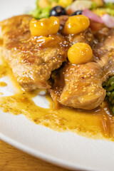chicken breast with cape gooseberry sauce, green rice and fruit salad