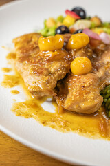chicken breast with cape gooseberry sauce, green rice and fruit salad