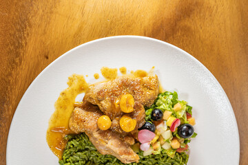 chicken breast with cape gooseberry sauce, green rice and fruit salad