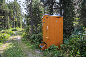 Mobile compost toilet at a hiking roadside. The eco friendly toilet uses sawdust to cover human excrement for cycling.