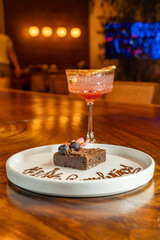 chocolate brownie dessert with fruits, cocktail and decoration with 