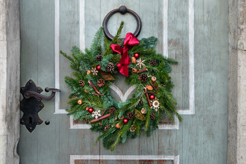 Natural spruce christmas wreath on the door.