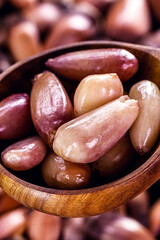 wooden spoon with boiled pine nuts, traditional Brazilian cooking ingredient