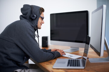 Man, hoodie and hacker on computer for digital information for password error, cyber security or database glitch. Male person, dual screen and online programming for malware code, stealing or network