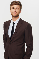 Portrait, business and a confident young man in studio on a white background for a corporate career or job opportunity. Company, work and a professional person in a suit as an employee or salesman