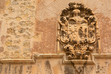 Heraldic stone shield on old stone façade in Albarracín (Spain)