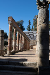 Ancient Roman ruins form Merida, Spain with columns on a sunny day, showcasing historical...