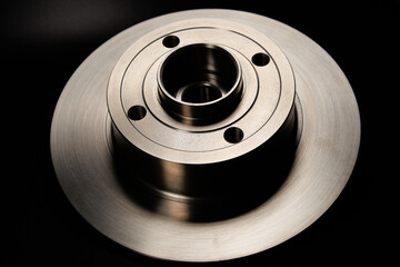 New brake disc on a black background.