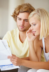 Paper, finance and couple with documents in a house for future planning, investment or asset management. Paperwork, insurance and people in a living room for bills, mortgage or home loan application