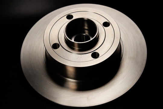 New brake disc on a black background.