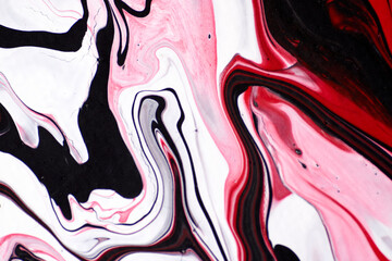 Marbled acrylic colored pattern in the colors red, black, white and pink. © horst
