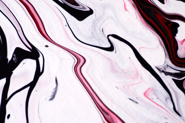 Marbled acrylic colored pattern in the colors red, black, white and pink. © horst
