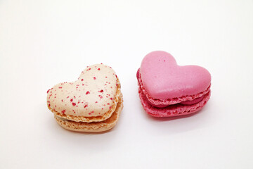 Group of heart shaped macaroons on white background.