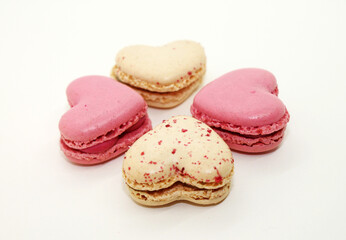 Group of heart shaped macaroons on white background close-up.