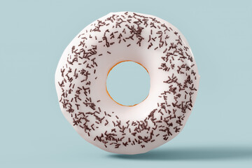 Chocolate glazed donut with sprinkles on a grey background