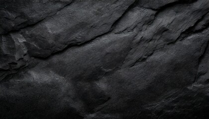 black or dark gray rough grainy stone or sand texture background