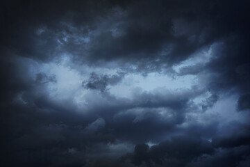 Black dark blue gray sky with heavy clouds. Dramatic background. Storm hurricane wind rain cloudy....