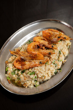 Delicious shrimp a&ccedil;orda served in a restaurant, a traditional Portuguese dish with savory flavors.