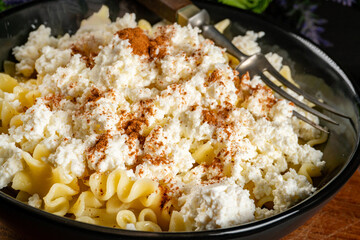 Pasta with cottage cheese, cinnamon and sugar.