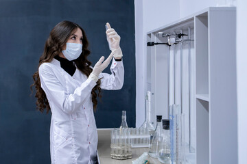 a female student in the university, studying at the biology and chemistry department
