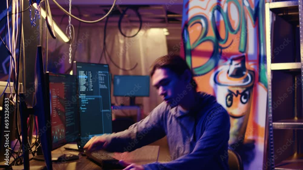 Poster tracking shot of asian hacker arriving in hidden underground shelter, prepared to launch ddos attack