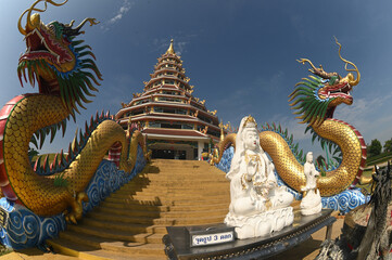 The staircase with dragon and Guan Yin Bodhisattva Statue to Phop Chok ThamaChedi Phra Maha Chedi...