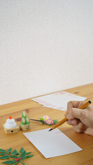 日本の年賀状イメージ｜年賀状・筆ペン・門松・鏡餅