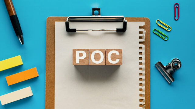 There is wood cube with the word POC. It is an abbreviation for Proof of Concept as eye-catching image.