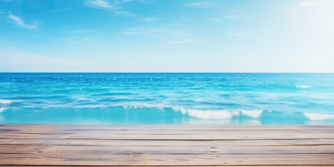 Fototapeta premium Blurred summer blue sea and sky background with wooden table top.
