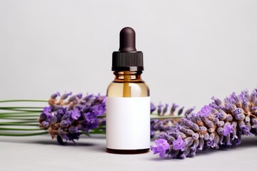 Obraz na płótnie Canvas An essential oil bottle featuring a white label mockup surrounded by lavender flowers, ideal for label design