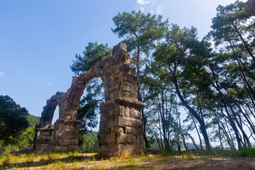Ruins of aquaeduct in ancient city Phaselis, Antalya Province, Turkey. Lycian ancient civilization...