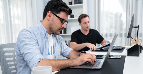 Businessman searching information on computer to analyze business plan to make promotion for market...