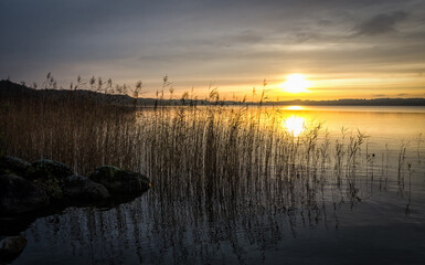 November sunrise over the Swedish lake - 693244091