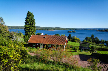 Swedish cottage on the lake coast