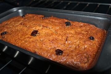 Banana bread with raisins in oven 3