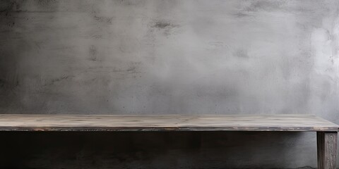 Old gray concrete plaster background with an empty dark wooden table.