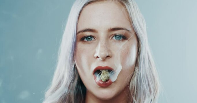 Smoking, weed and woman with marijuana in mouth with addiction to plant with thc and bud. Drugs, smoke and portrait of person with cannabis, herbs and abuse of legal substance burning on lips