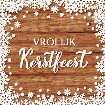 Vrolijk Kerstfeest calligraphy hand lettering on wood background with snowflakes. Merry Christmas typography poster in Dutch. Vector template for greeting card, banner, flyer, etc.