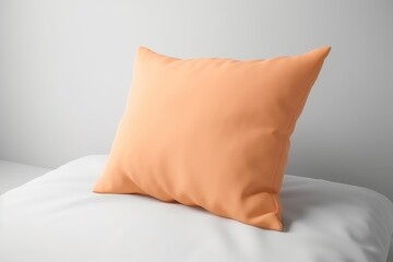 An orange pillow sitting on top of a white bed, peach fuzz, trendy color of the year 2024.