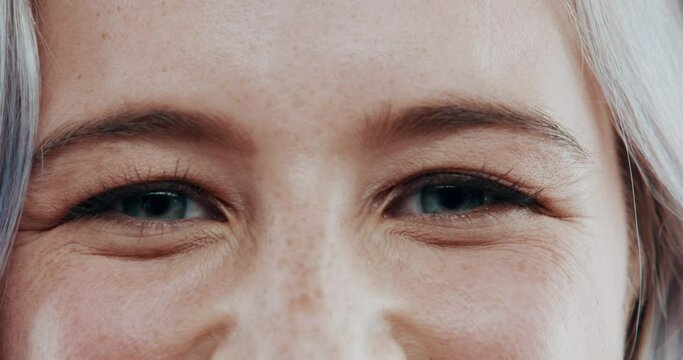 Happy, eyes and face of person closeup with vision, blinking and sight with blue iris. Optometry, portrait and woman with a smile and eyesight with eyelashes, eyebrows and skin with freckles in macro